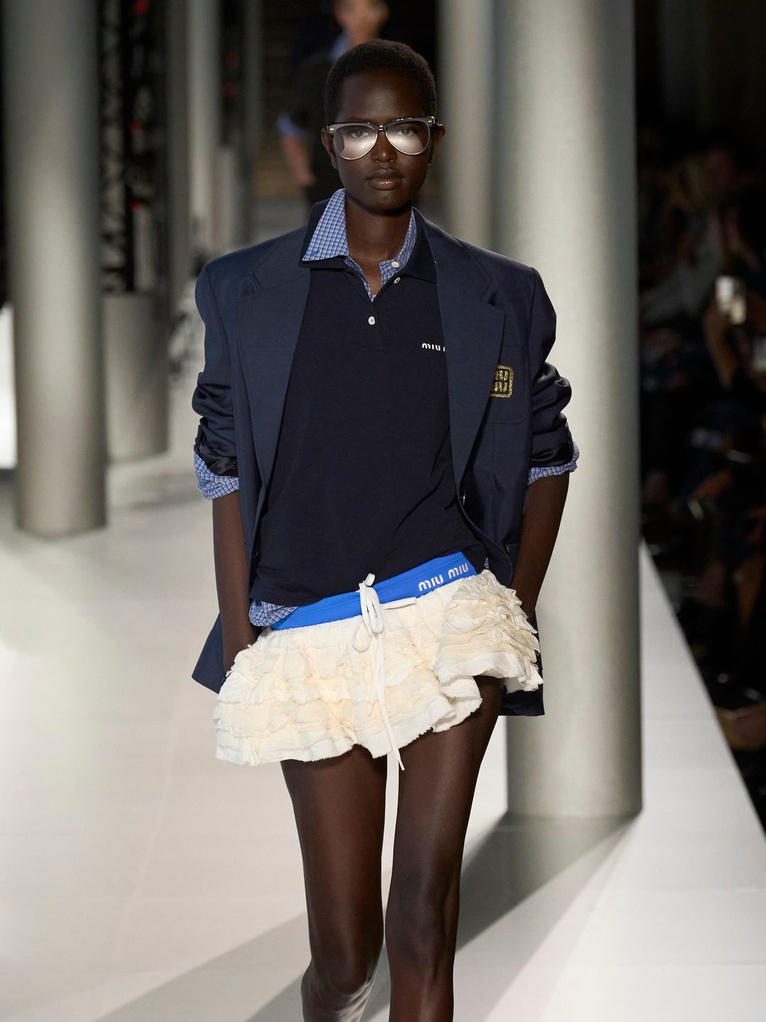 Miu Miu SS24 model wearing navy blazer, shirt and polo top combo 