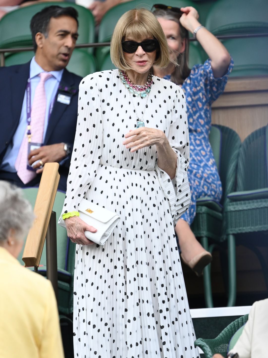 Anna Wintour wearing a pleated polka dot dress 