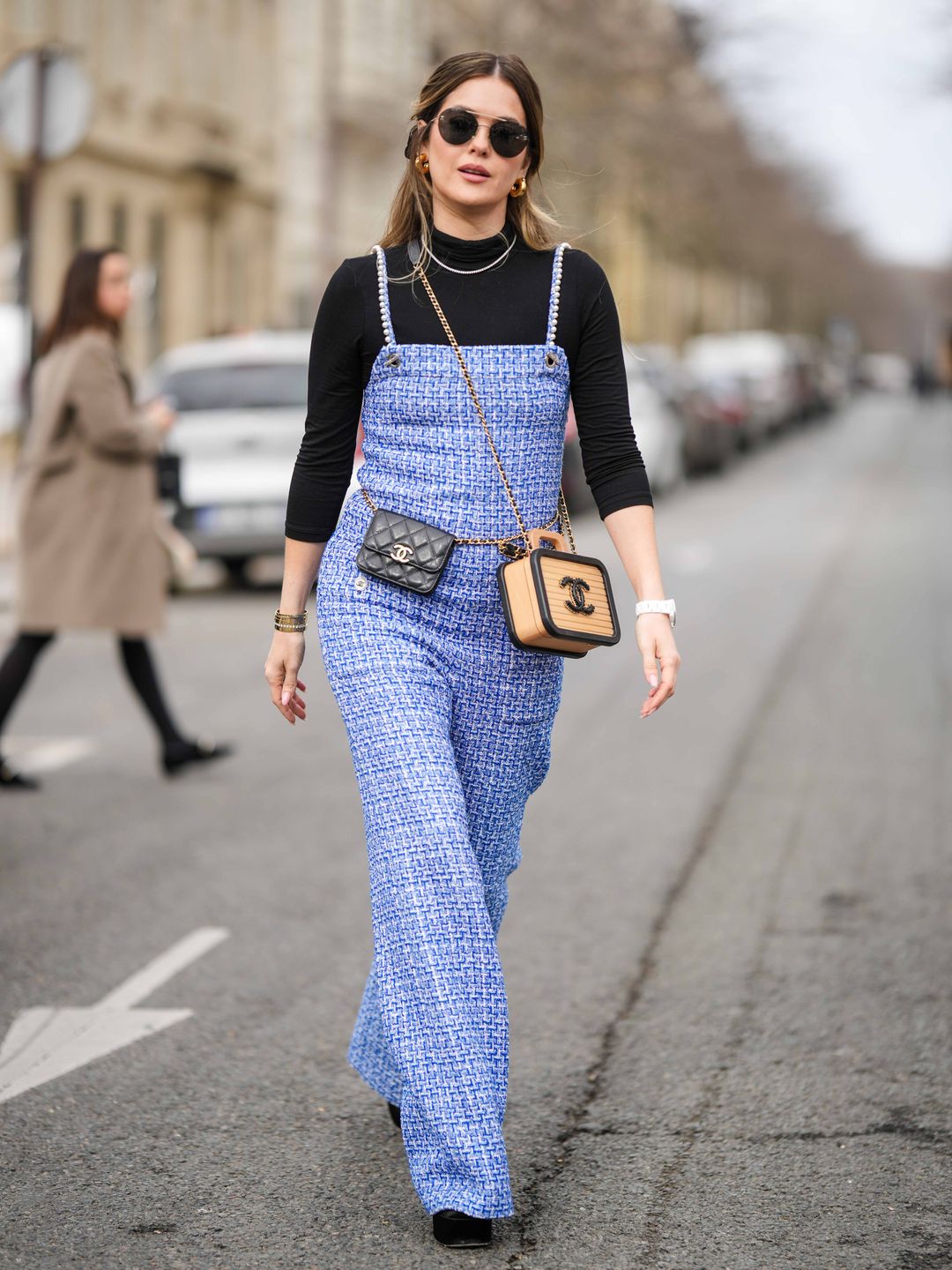 Paola Alberdi wearing a black polo neck under a bouclé jumpsuit 