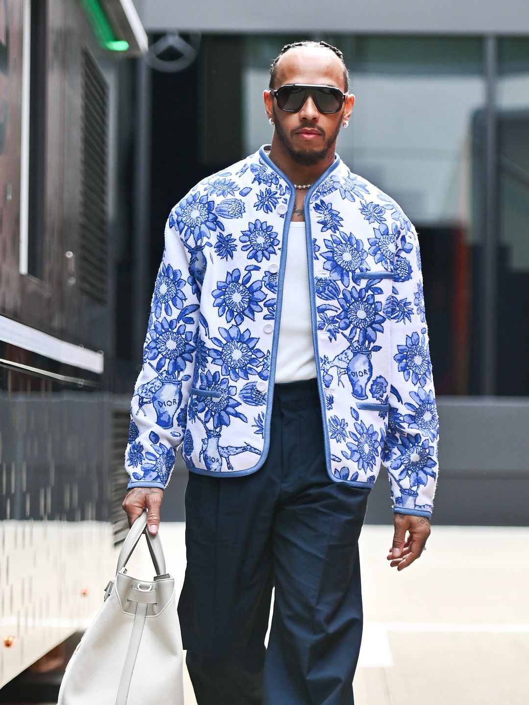 Lewis Hamilton of Great Britain and Mercedes arrives in the paddock during previews ahead of the F1 Grand Prix of Great Britain at Silverstone Circuit on July 4, 2024 in Northampton, England.(Photo by Vince Mignott/MB Media/Getty Images)