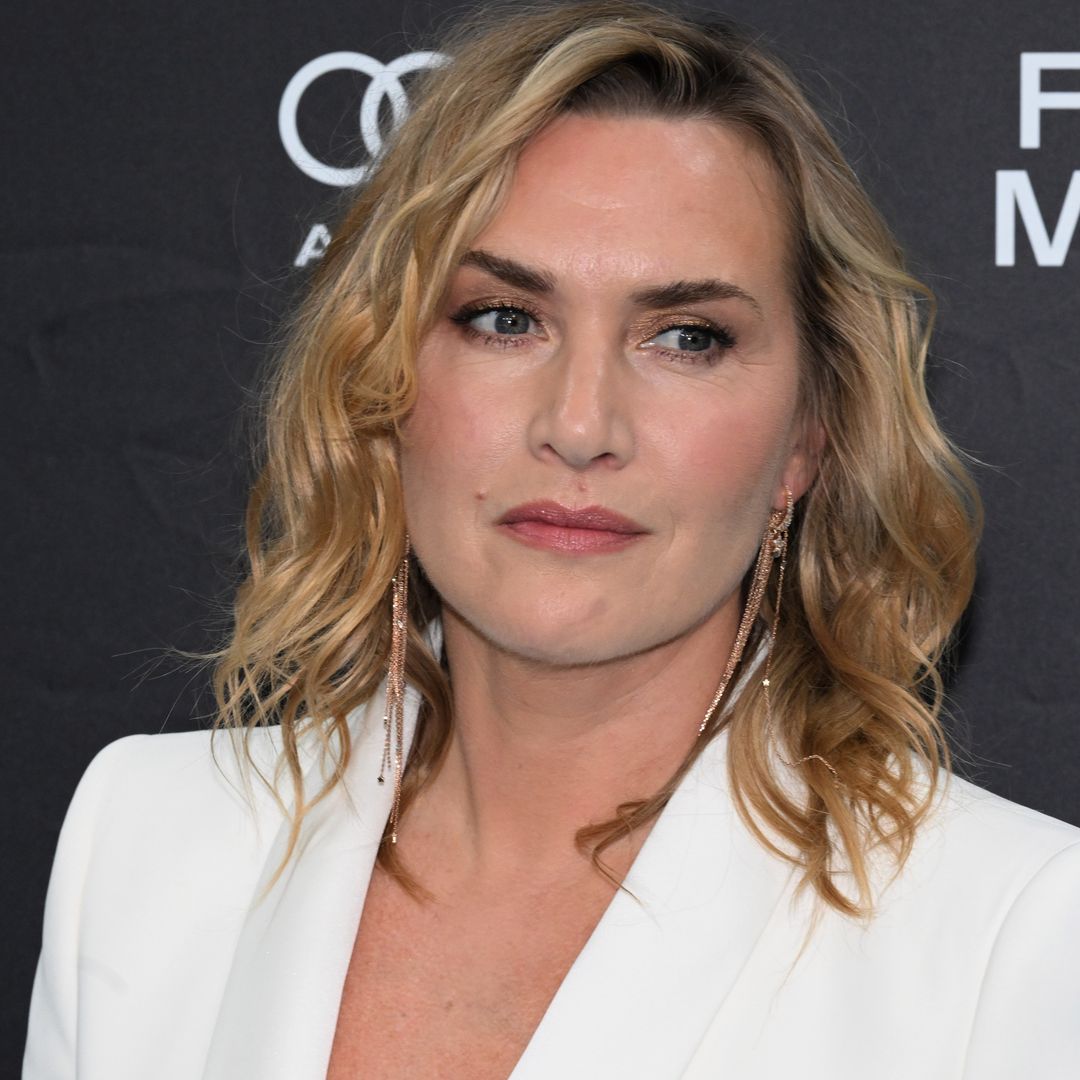 Kate Winslet is a vision in fitted bridal white suit