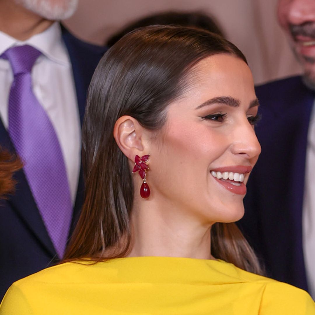 Princess Rajwa of Jordan cradles baby bump in ruched designer gown and glimmering jewels