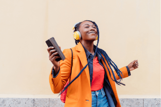 woman headphones apple music vs spotify