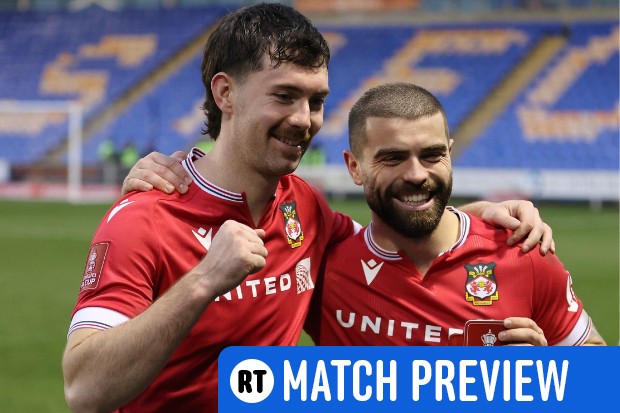 Wrexham players celebrate following an FA Cup victory