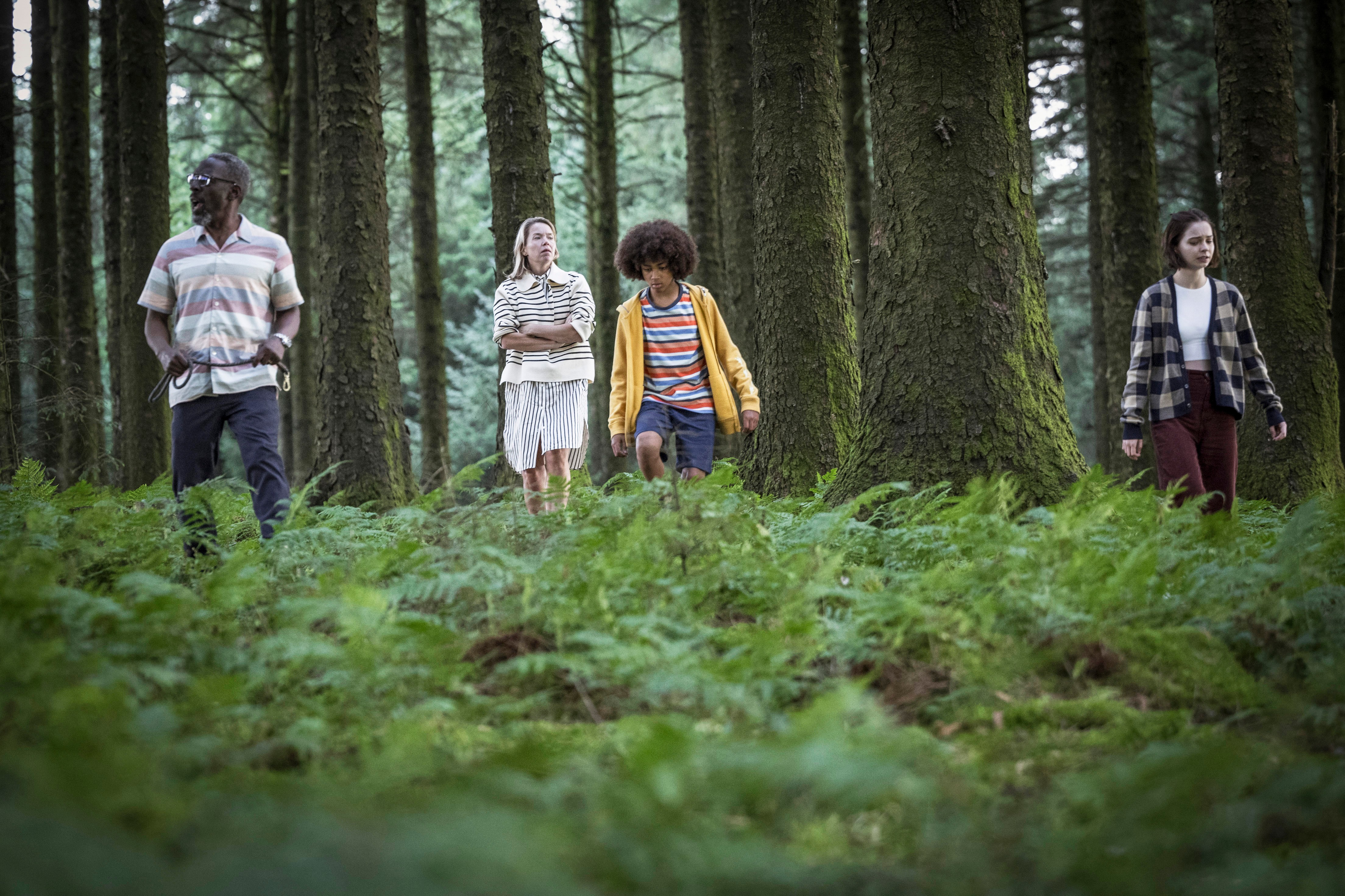 Pip and her family searching for something in the woods