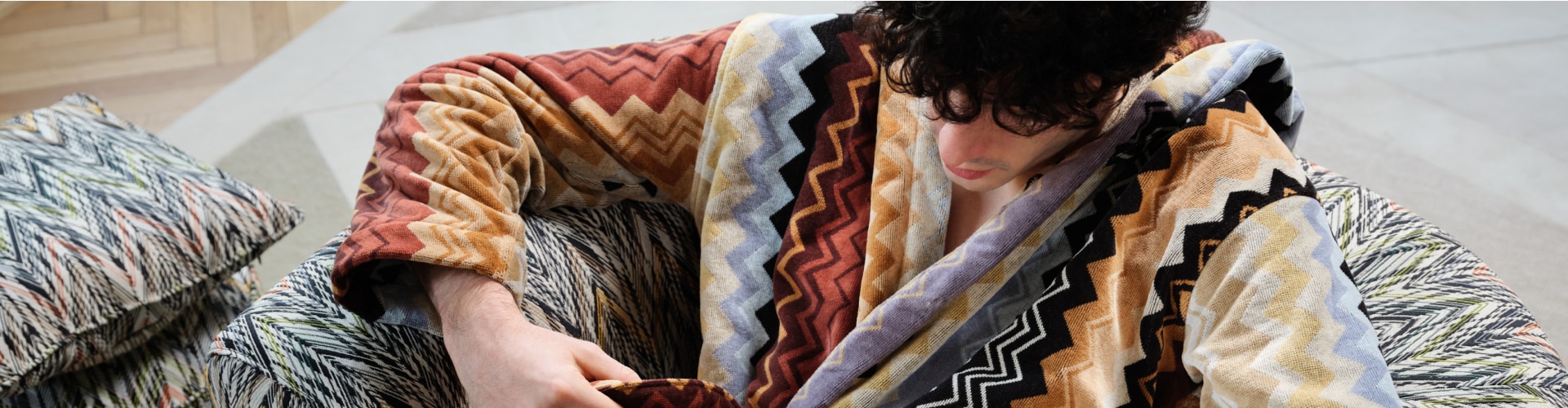 A model is wearing a brown Giacomo Bathrobe