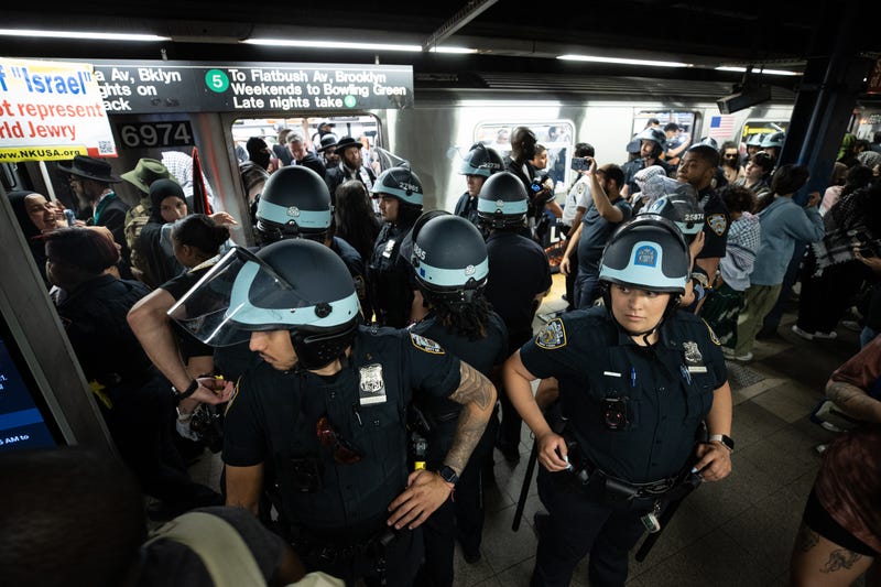 Police intervene inside the subway station as protesters gather at Union Square in New York City on June 10, 2024.