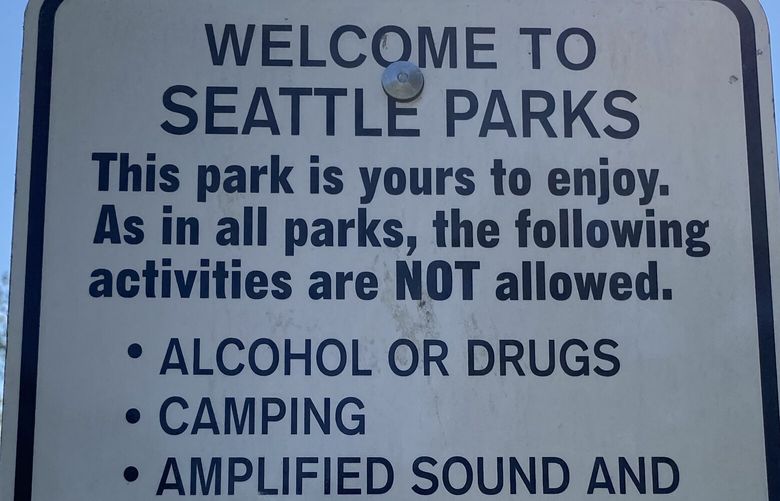 A Seattle Parks sign lists activities not allowed at Atlantic City Boat Ramp in Seward Park, photographed on Thursday, June 22, 2023.