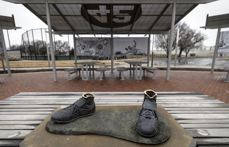 A bronze statue of legendary baseball pioneer Jackie Robinson was stolen from a park in Wichita, Kan., during the early morning hours of Thursday, Jan. 25, 2024. The statue, valued at $75,000, was the centerpiece of the League 42 ballpark facility, a baseball league started in 2015 to help kids with little access to organized sports. The league currently has 600 kids signed up to play this spring. Wichita police said during a Friday news conference that they are working desperately to catch the thieves. (Travis Heying/The Wichita Eagle via AP) KSWIE551 KSWIE551