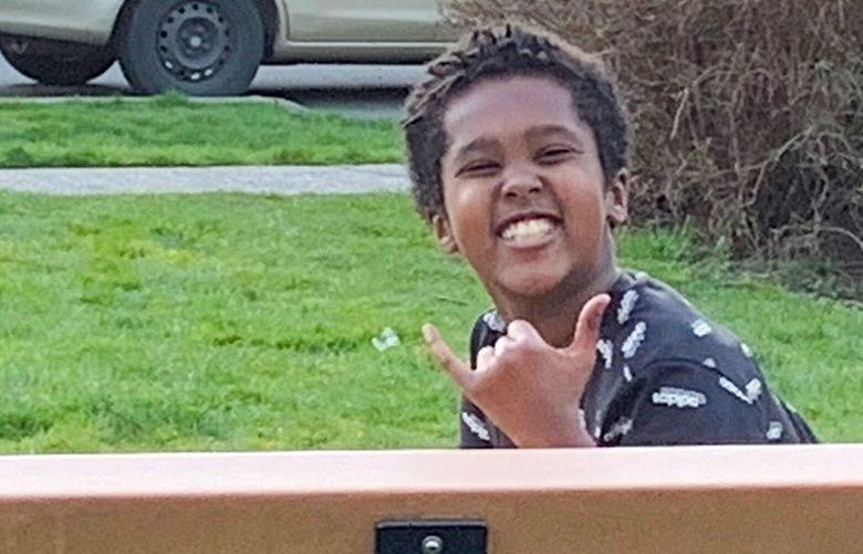 Mobarak Adam is pictured outside his family’s home in West Seattle in 2021. On Jan. 23, the 15-year-old was shot and killed at the Southwest Teen Life Center.