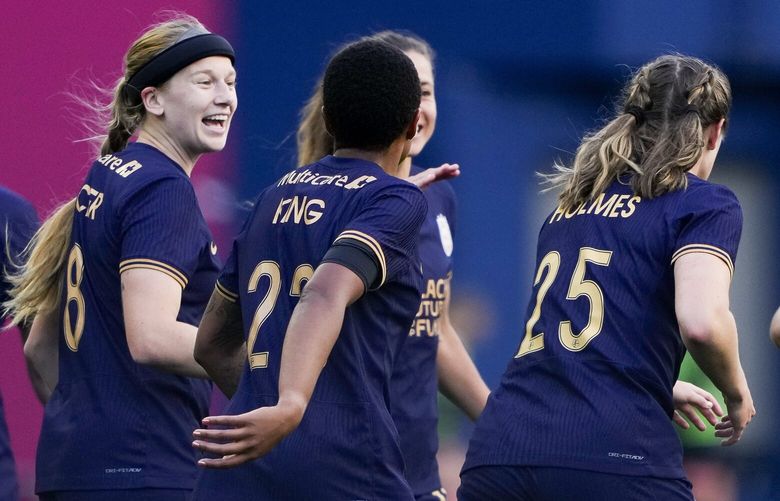 Seattle Reign forward Bethany Balcer (8) celebrates her goal against the Orlando Pride with teammates, including forward Tziarra King (23) during the second half of an NWSL soccer match, Sunday, May 19, 2024, in Seattle. Orlando won 3-2. 226948