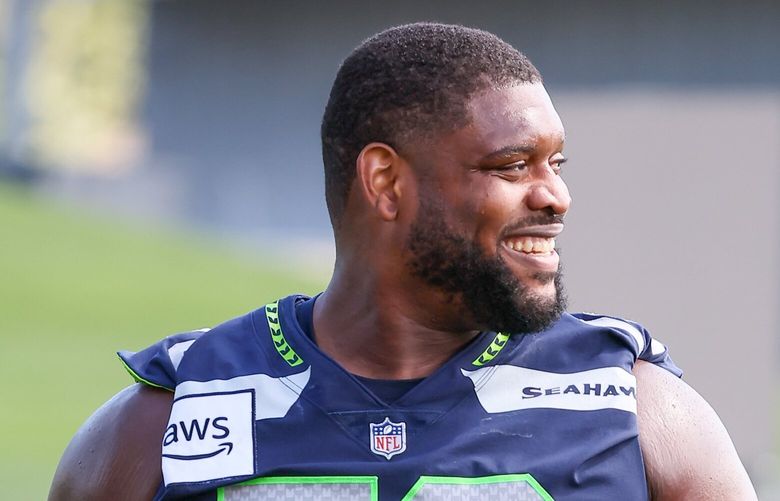 Laken Tomlinson makes his off the field after practice on the first day of the three-day Seahawks minicamp Tuesday afternoon at the Virginia Mason Athletic Center in Renton, Washington, on Jane 11, 2024. 227092