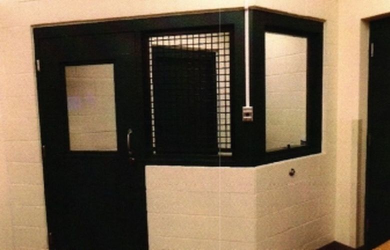 Cowlitz County Court routinely required defendants to appear for court hearings in this holding cell, in a courtroom in the county hail. The state Supreme Court ruled the practice unconstitutional. (Washington State Supreme Court)