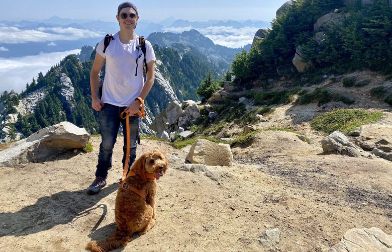 Harrison the Goldendoodle and author Corbin Reiff are pictured in the Central Cascades.