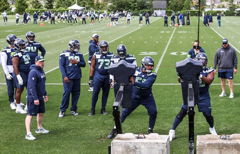 The Seahawks work a sled, during OTAs, organized team activities Wednesday afternoon at the Virginia Mason Athletic Center in Renton, Washington, on May 22, 2024. 226938
