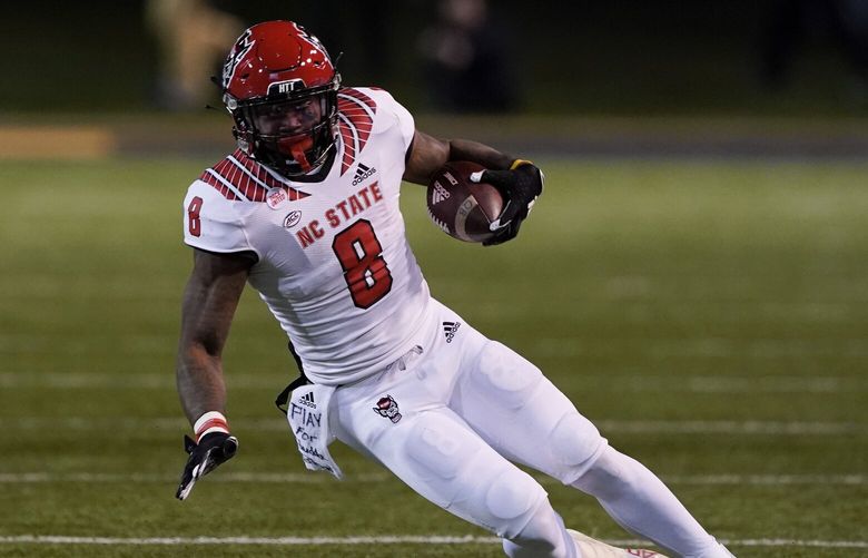 North Carolina State running back Ricky Person Jr. runs during the second half of an NCAA college football game against Wake Forest Saturday, Nov. 13, 2021, in Winston-Salem, N.C. (AP Photo/Chris Carlson)