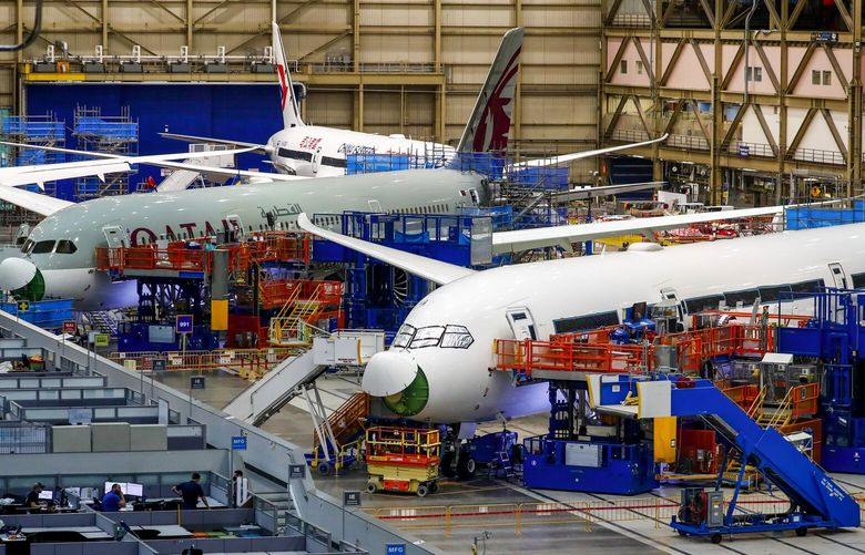 Inside Boeing’s Everett plant in June, mechanics checked for defects in the structural joins on previously built 787 aircraft and performed re-work where needed.