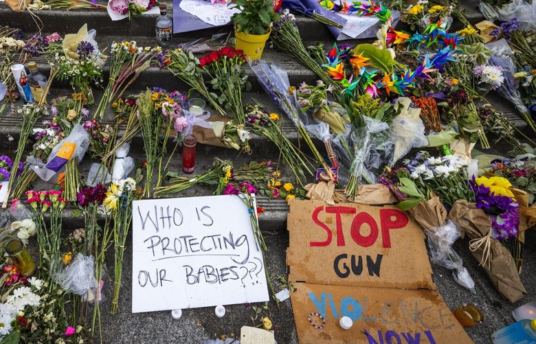 A memorial for Garfield High School student Amarr Murphy-Paine, 17, is seen before students were welcomed back to the school by parents, community members and school staff, Tuesday, June 11, 2024 in Seattle.