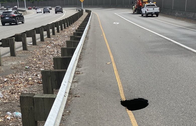 A culvert failure caused a hole in the road on the onramp from Highway 99 to eastbound Highway 518 in Tukwila Tuesday, on July 2, 2024.