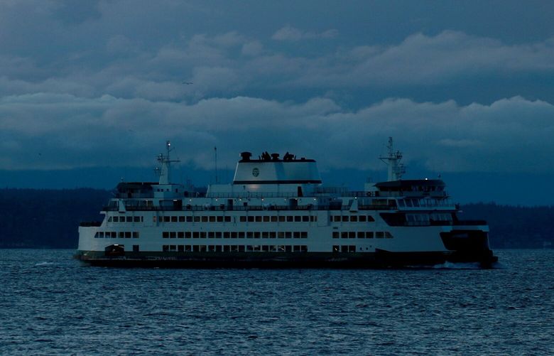 Clouds and three ferries are seen at sunset from West Seattle Monday, Jan. 25, 2020. 
LO 216225