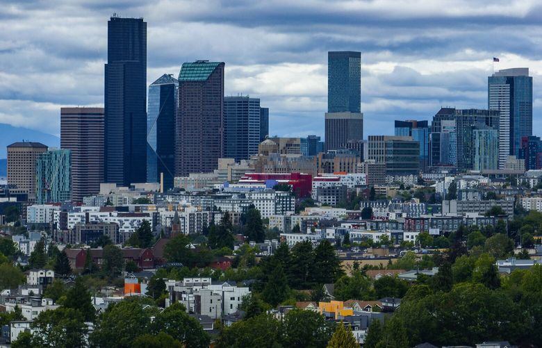 As Seattle’s higher density continues, newer Yesler Terrace and Central District apartments are seen from the air with downtown Seattle as a backdrop, Wednesday, June 26, 2024.