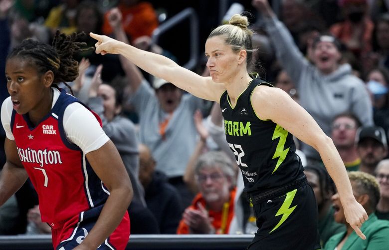 Seattle Storm guard Sami Whitcomb (32) reacts after making a 3-point basket, next to Washington Mystics guard Ariel Atkins (7) during the first half of a WNBA basketball game Saturday, May 25, 2024, in Seattle. (AP Photo/Lindsey Wasson) WALW605 WALW605