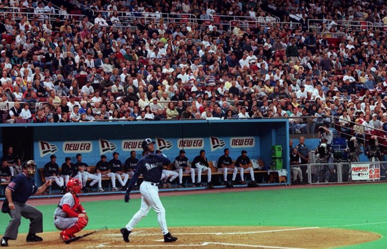 Ken Griffey, Jr. drops his bat and watches the last home run he will ever hit at the Kingdome sail away into the stands.  His first up in the last game — first inning.  Mariners beat the Texas Rangers 5 – 2 in their last game in the dome.