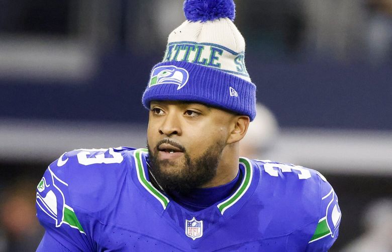 Seattle Seahawks safety Jamal Adams (33) walks on the field prior to an NFL Football game in Arlington, Texas, Thursday, Nov. 30, 2023. (AP Photo/Michael Ainsworth) OTK110