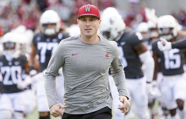 Washington State head coach Jake Dickert runs onto the field with his team before an NCAA college football game against Oregon State, Saturday, Sept. 23, 2023, in Pullman, Wash. (AP Photo/Young Kwak) OTK