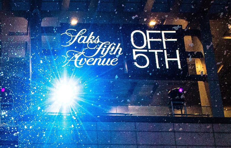 A snow machine dusts snow on the crowd during the annual tree lighting ceremony at Westlake Center on Friday, November 23, 2018. Downtown Seattle’s Saks OFF 5th, a spin-off of Saks Fifth Avenue, will close on July 20.