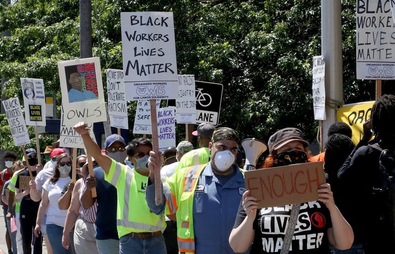 Metro employees held an “informational protest” at noon outside Metro’s South base in Tukwila in response to an African statue reportedly found hanging from a noose at the base (Metro is investigating) and issues of structural racism at Metro, Thursday, June 25, 2020. 214299