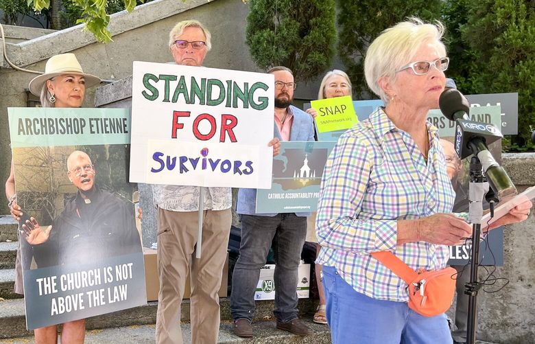 Mary Dispenza, a child sexual abuse survivor, speaking in front of St. James Cathedral, July 11, 2024, in Seattle’s First Hill neighborhood.