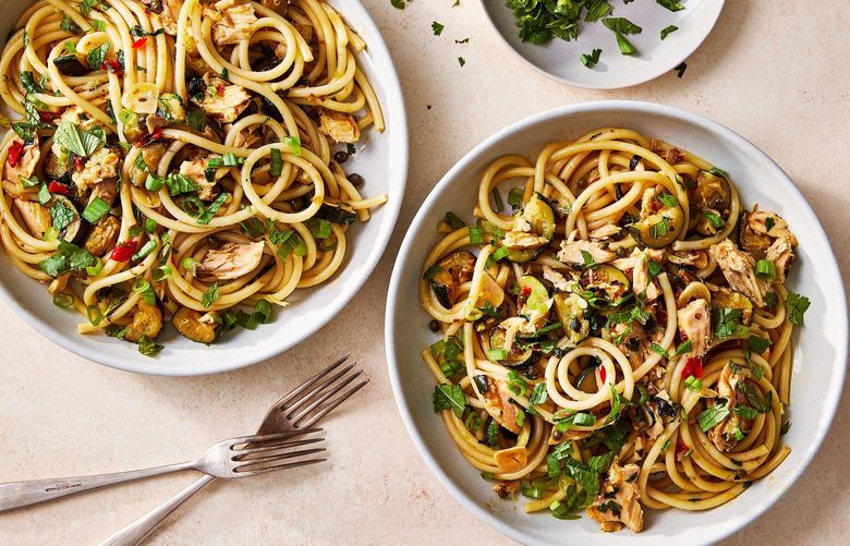Zucchini pasta with tuna and chile paste. Adding zucchini, tuna and loads of fresh herbs makes this dish light, bright and weeknight easy. Food styled by Barrett Washburne. (Rachel Vanni/The New York Times) XNYT0385 XNYT0385