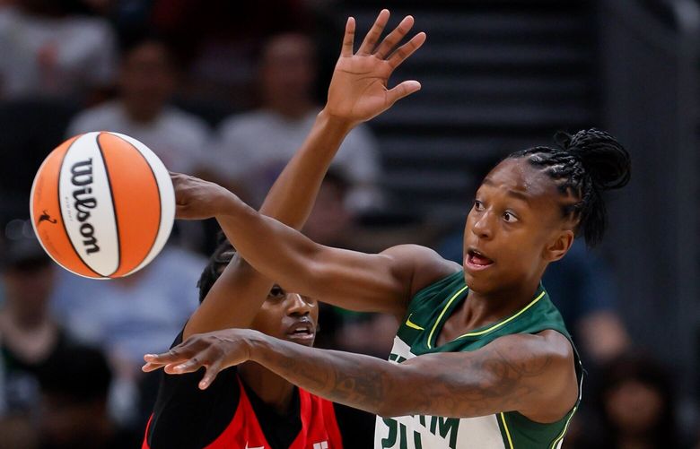 Seattle Storm guard Jewell Loyd passes the ball as Atlanta Dream guard Maya Caldwell defends during the second quarter Sunday, July 14, 2024 in Seattle. 227423