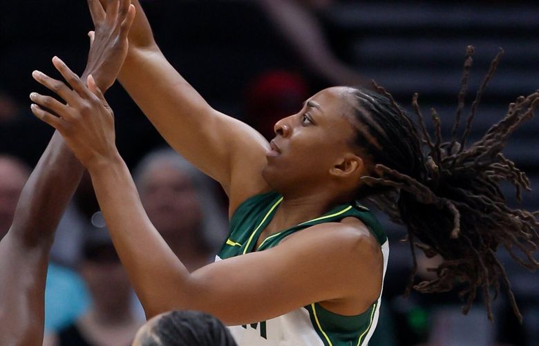 Seattle Storm forward Nneka Ogwumike puts up a shot over Atlanta Dream center Tina Charles during the first quarter Sunday, July 14, 2024 in Seattle. 227423