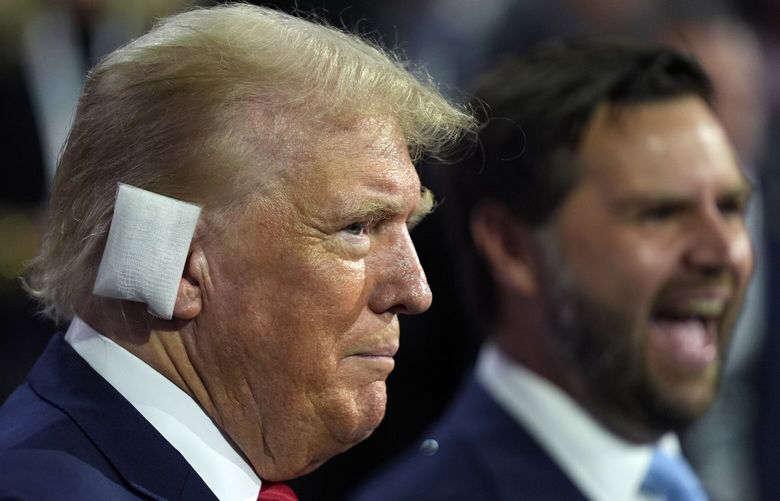 Republican presidential candidate former President Donald Trump and Republican vice presidential candidate Sen. JD Vance, R-Ohio, attend the first day of the Republican National Convention, Monday, July 15, 2024, in Milwaukee. (AP Photo/Evan Vucci) WIEV362 WIEV362