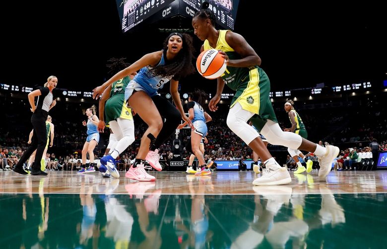 Seattle Storm guard Jewell Loyd dribbles the ball away as Chicago Sky forward Angel Reese (5) yells out during the first quarter Sunday, July 7, 2024 in Seattle. 227296