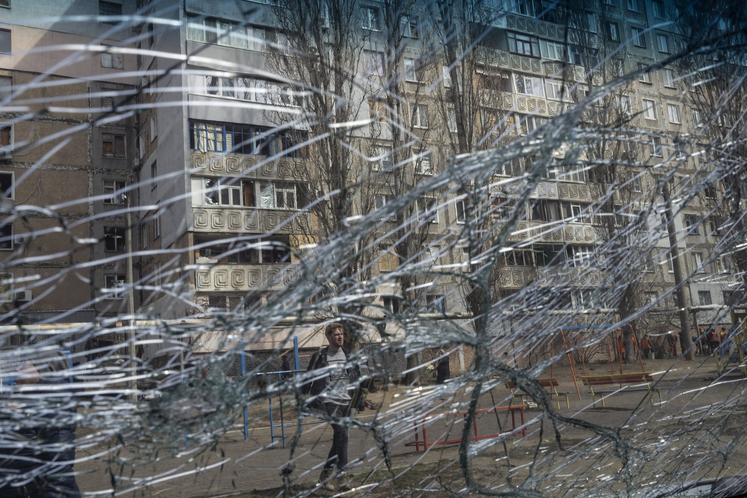  A man in seen through the front glass of a damaged car after a Russian attack the previous night in the residential area of Mikolaiv, Ukraine, on Tuesday, March 29, 2022. (AP Photo/Petros Giannakouris) 