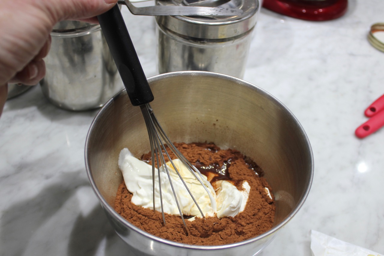 whisking cocoa and wet ingredients 