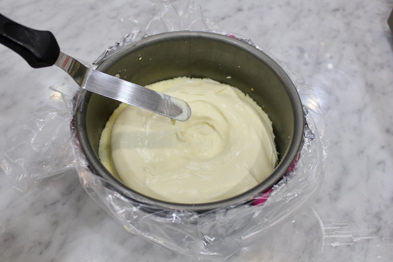 9) Spoon white chocolate batter and make crater