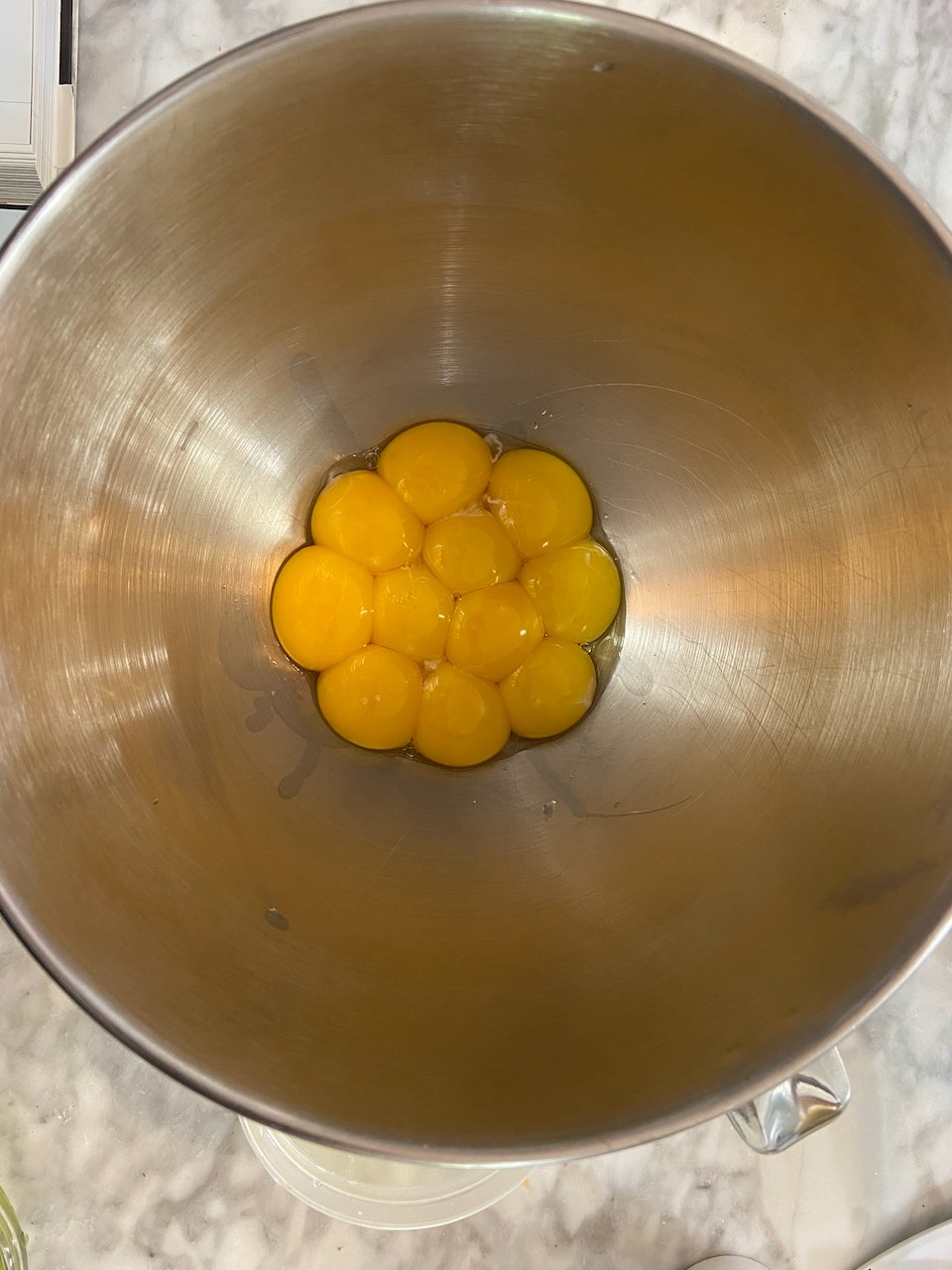 Separated and measured egg yolks before adding whites 