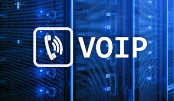 Words and logo for VoIP, Voice Over Internet Protocol, technology against blue server room background