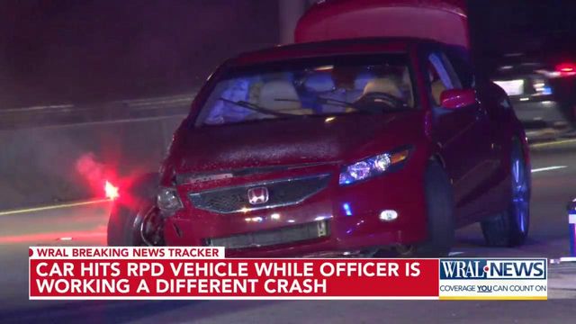 Car hits RPD vehicle while officer investigating different crash