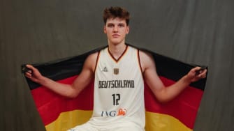 Four-star prospect Eric Reibe poses in his uniform with the German flag after representing Germany on the U18 team.