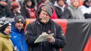 Cincinnati Bengals offensive line coach Frank Pollack takes notes between plays in the first quarter