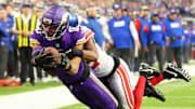 Jan 15, 2023; Minneapolis, Minnesota, USA; Minnesota Vikings wide receiver Justin Jefferson (18) dives for the end zone as New York Giants cornerback Adoree' Jackson (22) defends during the first quarter of a wild card game at U.S. Bank Stadium. The call on the field was a touchdown but was changed after review. Mandatory Credit: Matt Krohn-Imagn Images