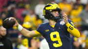 December 31, 2022; Glendale, Ariz; USA; Michigan quarterback JJ McCarthy (9) throws a pass during the pregame before the Fiesta Bowl at State Farm Stadium.

Ncaa Fiesta Bowl Game