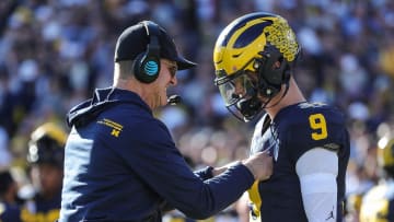 Michigan coach Jim Harbaugh talks to quarterback J.J. McCarthy before the start of the Rose Bowl vs.