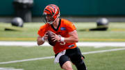 Bengals quarterback Joe Burrow scrambles during a minicamp practice at Paul Brown Stadium in Cincinnati on Tuesday.

Cincinnati Bengals Mini Camp