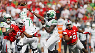 Oregon Ducks quarterback Anthony Brown (13) throws the ball against Ohio State Buckeyes defensive end Javontae Jean-Baptiste (8) during the fourth quarter in their NCAA Division I game on Saturday, September 11, 2021 at Ohio Stadium in Columbus, Ohio.